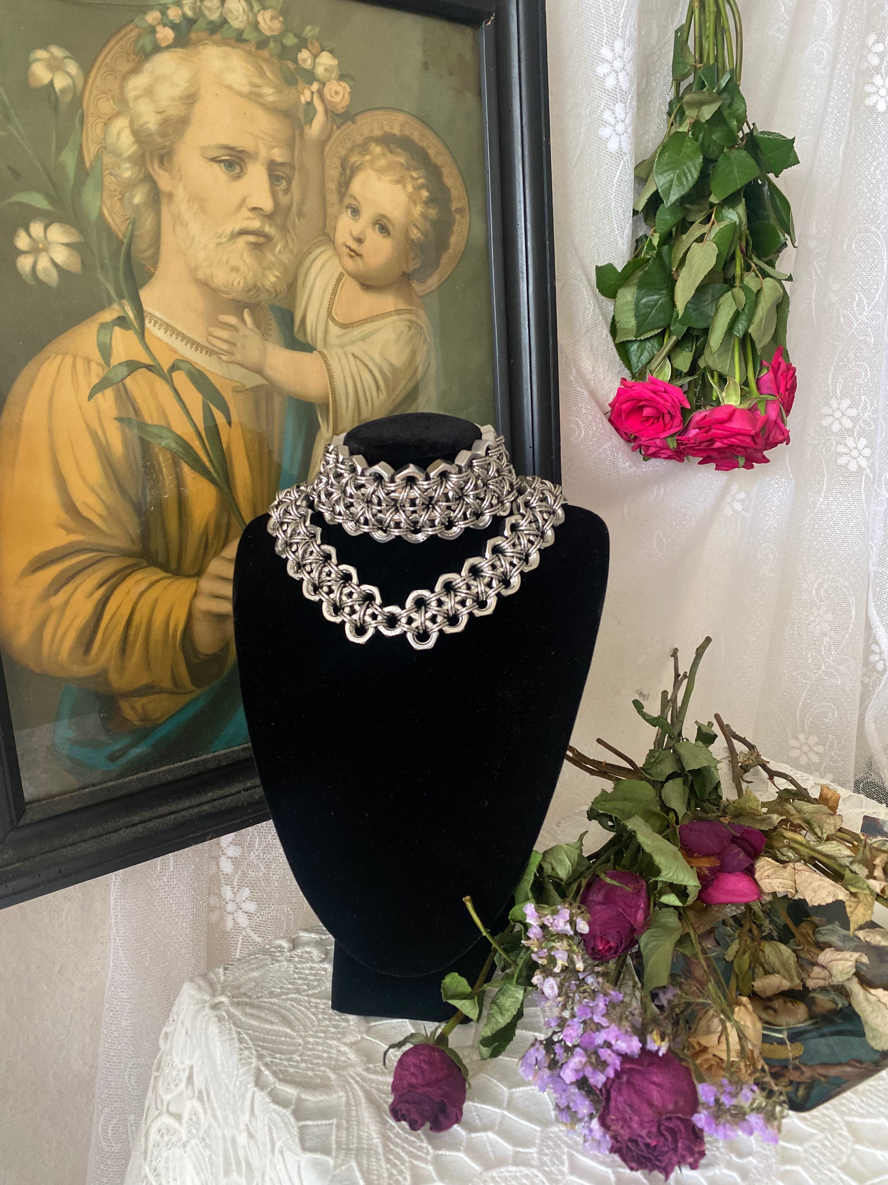 Two heavy industrial-style jewelry pieces made from stainless steel chainmail and authentic stainless steel screws for a true Berlin industrial look. One is a necklace, the other a choker. Bold, alternative, and edgy design.
