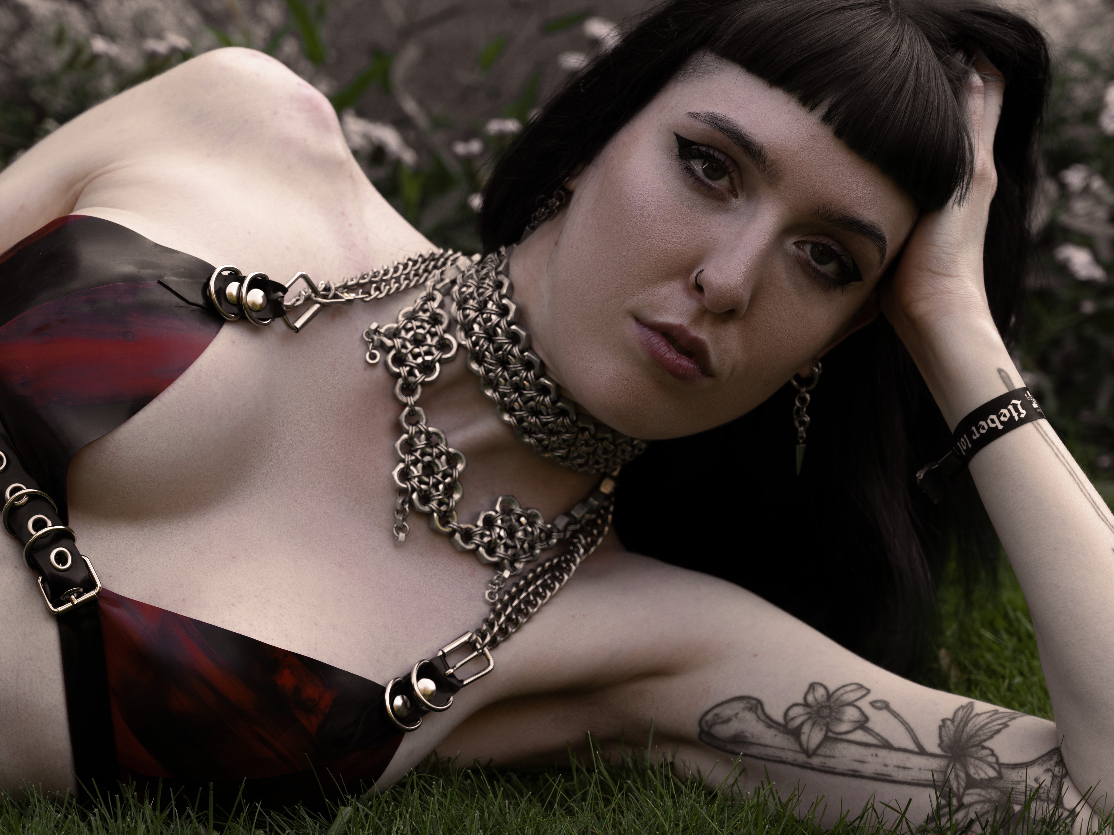 Alternative model wearing a Triple-Row Industrial Metal Choker Necklace made from stainless steel screws and chainmail, a durable high-fashion statement piece made in Berlin.