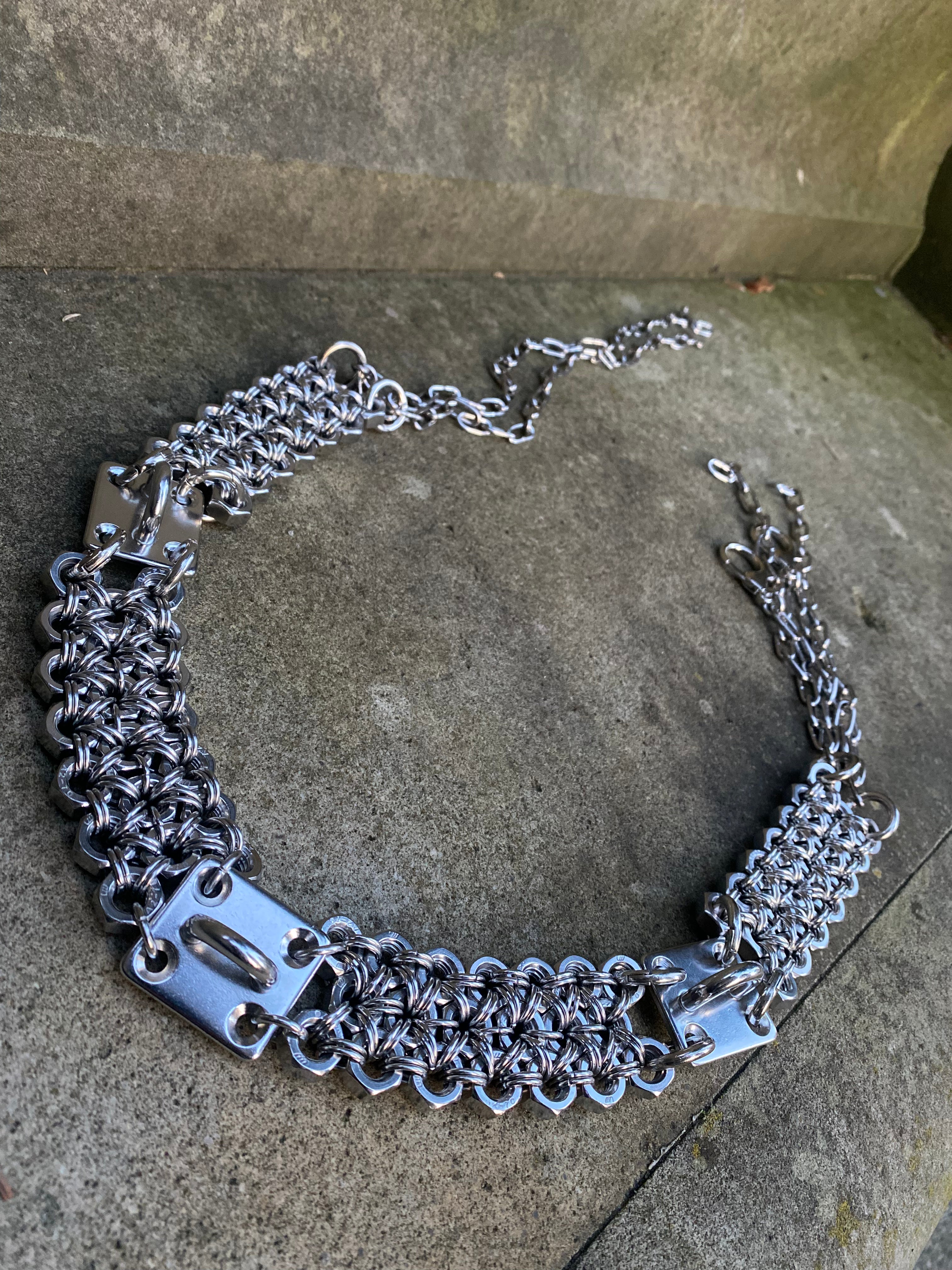handmade chainmail belt with unique chainmail pattern from stainless steel material presented on rock