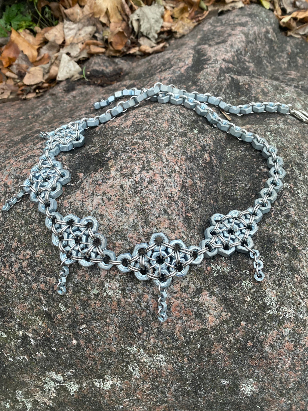 Unique handmade chainmail belt made from stainless steel rings and genuine screws, displayed in the photo. Crafted in Berlin, inspired by techno and alternative fashion.